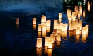 O-bon lanterns floating in a river.