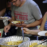 "PROGI"  Participants dish up homemade pierogi 